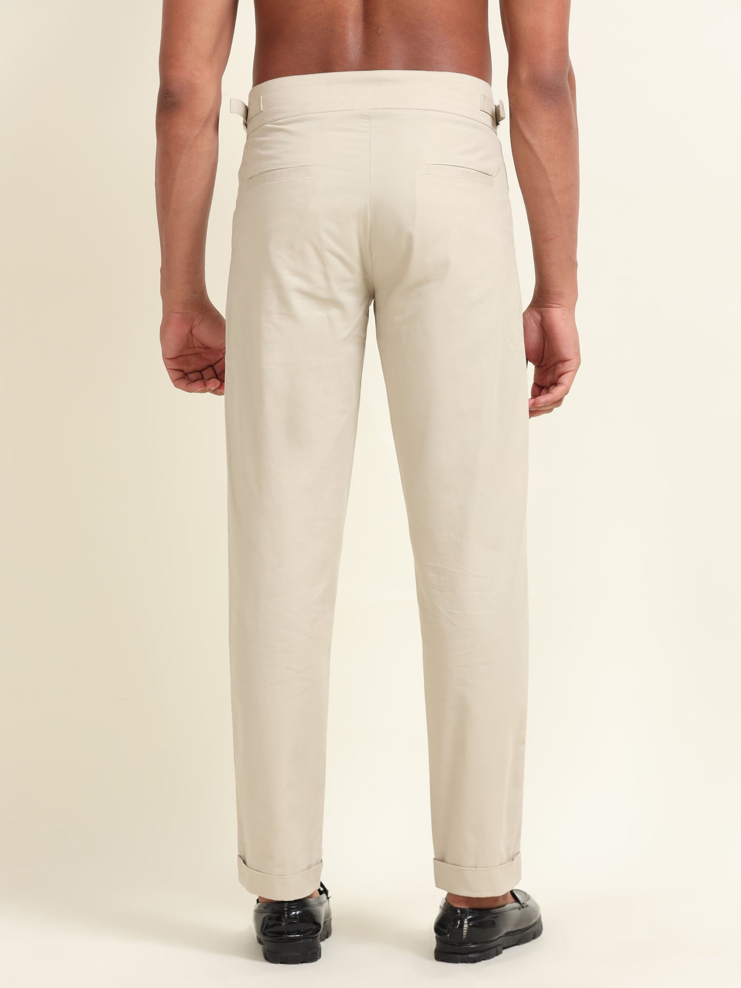 Beige double pleat straight fit pants styled for a smart-casual look, perfect for versatile wear in any modern wardrobe.